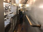 Service Technician Pressure Washing Restaurant Kitchen Floor